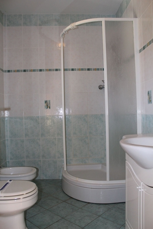 Imagen de la habitación del Hotel Diklo Beach Rooms. Foto 9