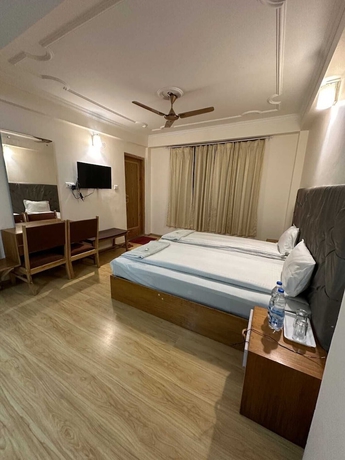 Imagen de la habitación del Hotel Dimbir Regency. Foto 9