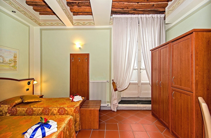 Imagen de la habitación del Hotel Dimora Dei Guelfi Luxury Rooms. Foto 2