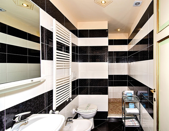 Imagen de la habitación del Hotel Dimora Dei Guelfi Luxury Rooms. Foto 4