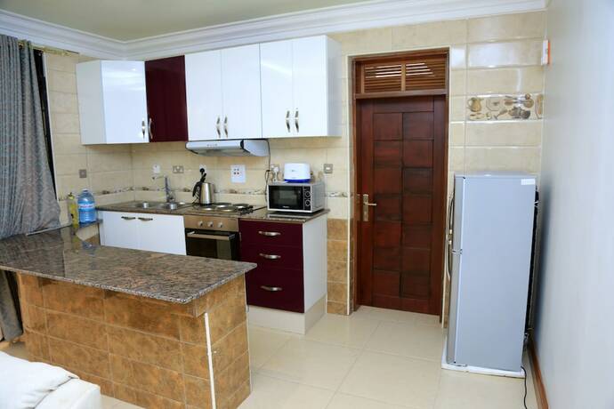 Imagen de la habitación del Hotel Dina Apartments. Foto 19