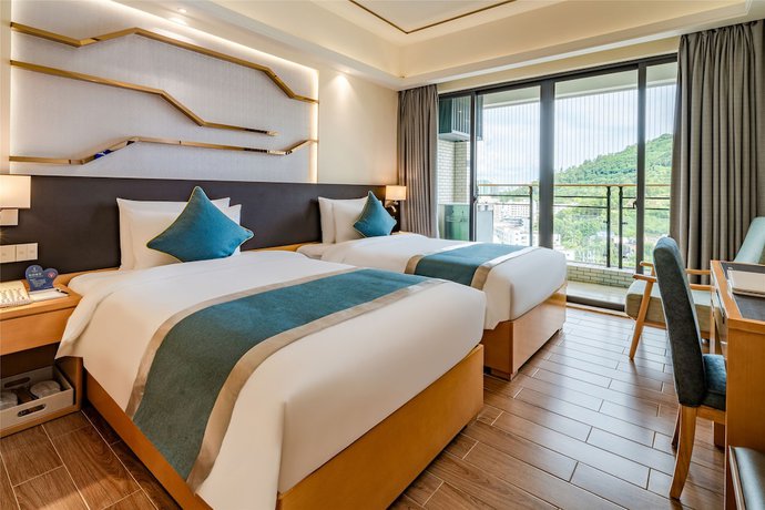 Imagen de la habitación del Hotel Ding Shang Service Apartment. Foto 7