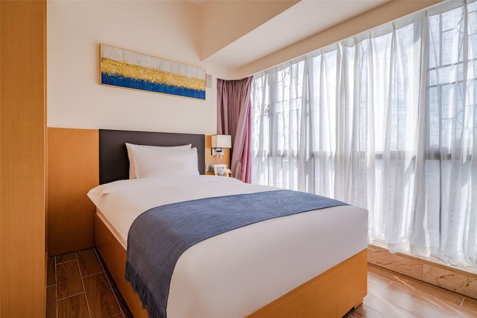 Imagen de la habitación del Hotel Ding Shang Service Apartment. Foto 11