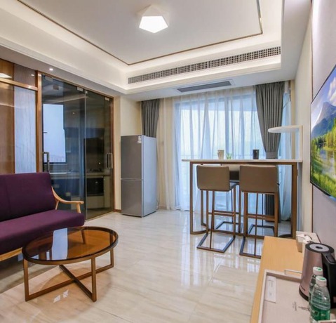 Imagen de la habitación del Hotel Ding Shang Service Apartment. Foto 12