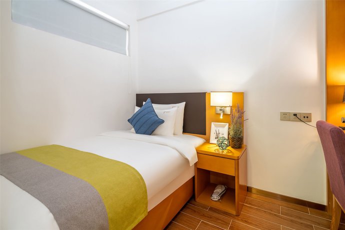 Imagen de la habitación del Hotel Ding Shang Service Apartment. Foto 14