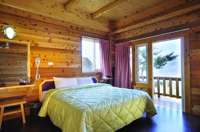 Imagen de la habitación del Hotel DingdaiGlass Villa. Foto 12
