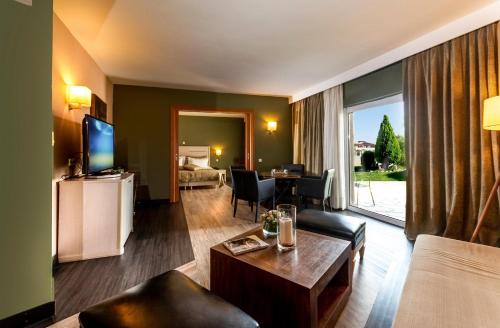 Imagen de la habitación del Hotel Dion Palace Resort and Spa. Foto 18