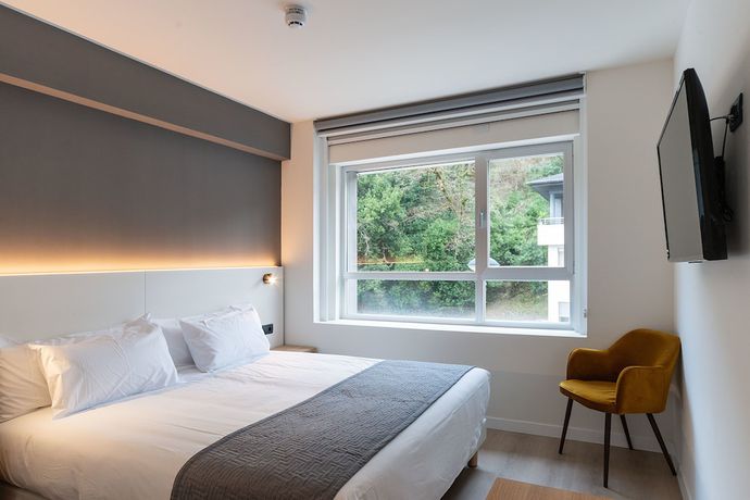 Imagen de la habitación del Hotel Distrito Oeste. Foto 12