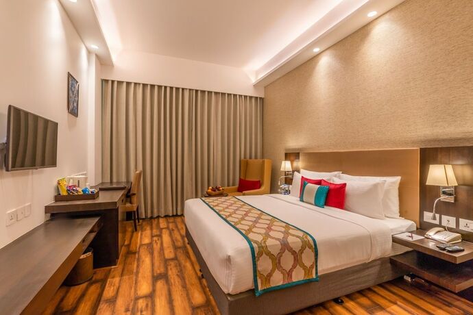 Imagen de la habitación del Hotel Divine Clarks Inn Suites. Foto 20