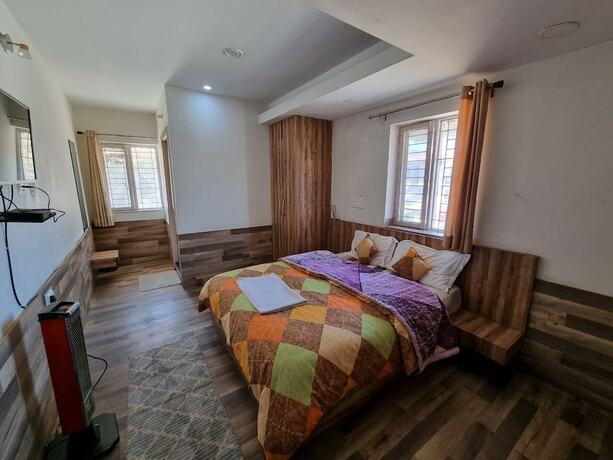 Imagen de la habitación del Hotel Divine Home Stay. Foto 10