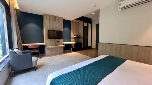 Imagen de la habitación del Hotel Divine River Resort by DLSs. Foto 18