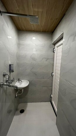 Imagen de la habitación del Hotel Divyakashi Homestay. Foto 17