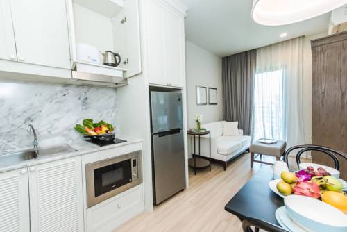 Imagen de la habitación del Hotel Dlux Condominium. Foto 2