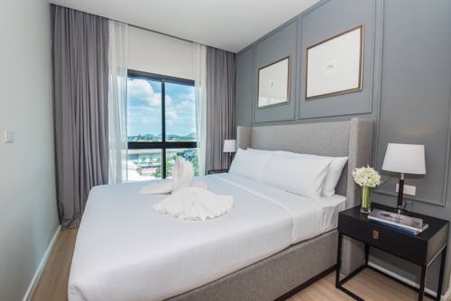Imagen de la habitación del Hotel Dlux Condominium. Foto 10