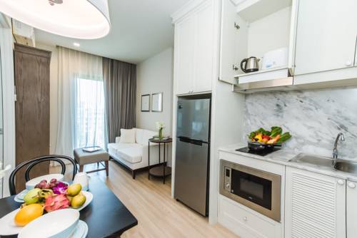 Imagen de la habitación del Hotel Dlux Condominium. Foto 12