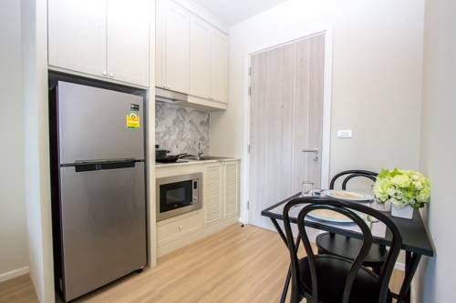 Imagen de la habitación del Hotel Dlux Condominium. Foto 14