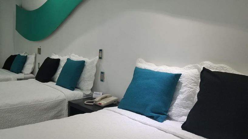 Imagen de la habitación del Hotel Dluxe and Suites. Foto 3