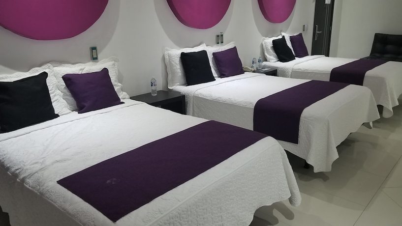 Imagen de la habitación del Hotel Dluxe and Suites. Foto 7