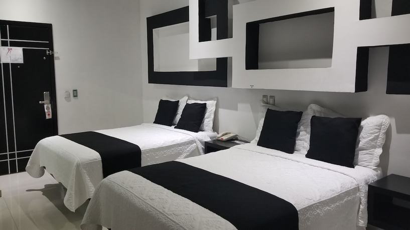 Imagen de la habitación del Hotel Dluxe and Suites. Foto 10