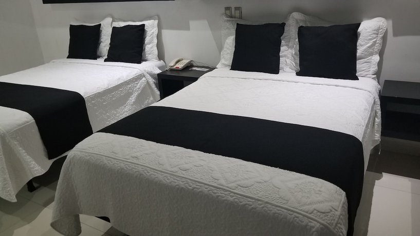 Imagen de la habitación del Hotel Dluxe and Suites. Foto 14