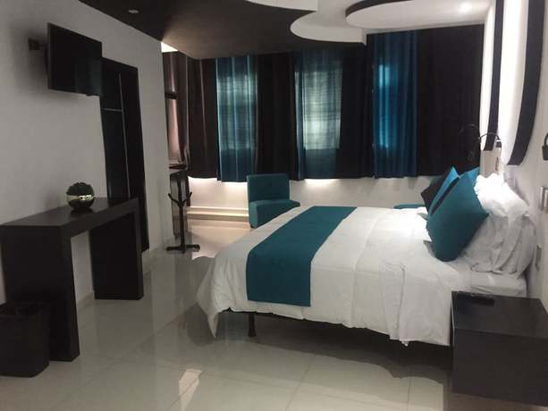 Imagen de la habitación del Hotel Dluxe and Suites. Foto 15