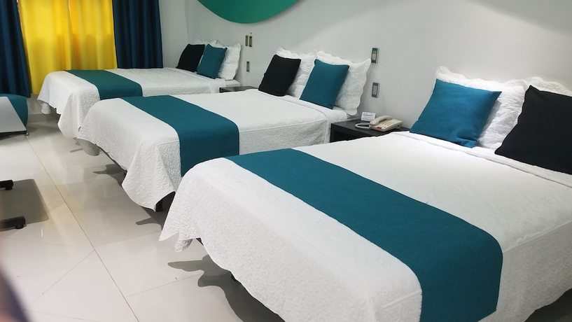 Imagen de la habitación del Hotel Dluxe and Suites. Foto 16