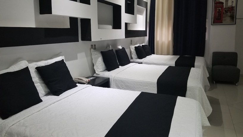 Imagen de la habitación del Hotel Dluxe and Suites. Foto 17