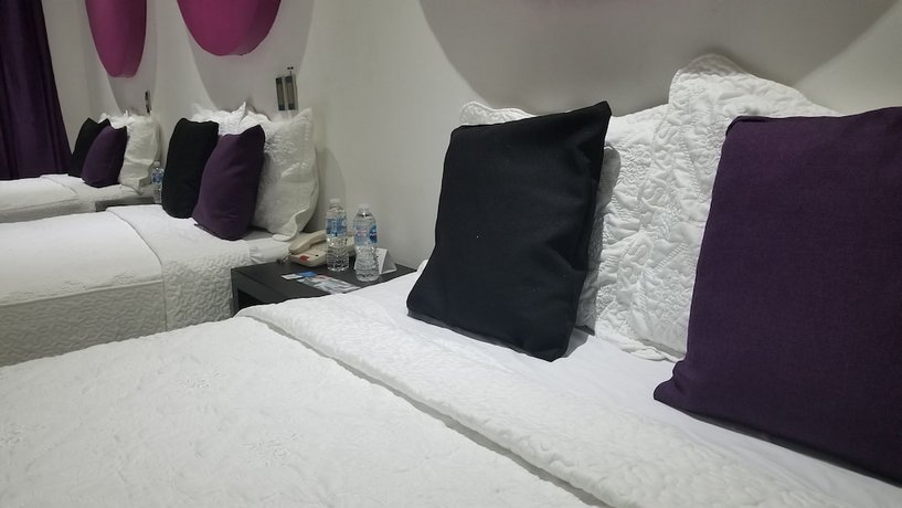 Imagen de la habitación del Hotel Dluxe and Suites. Foto 18