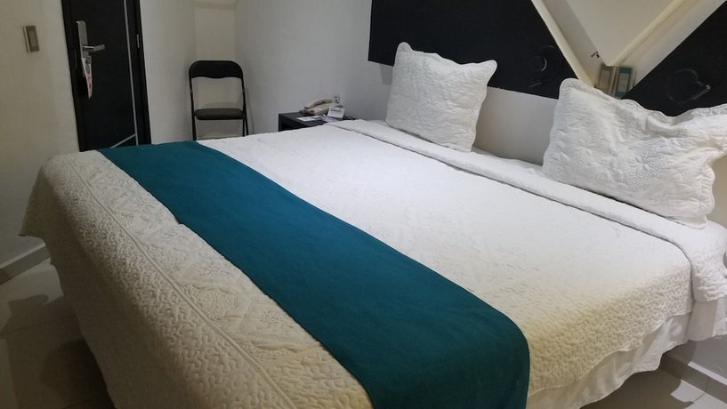 Imagen de la habitación del Hotel Dluxe and Suites. Foto 20