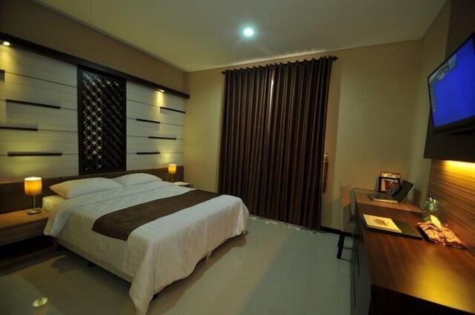 Imagen de la habitación del Hotel D'madinah Residence Syariah Solo. Foto 7