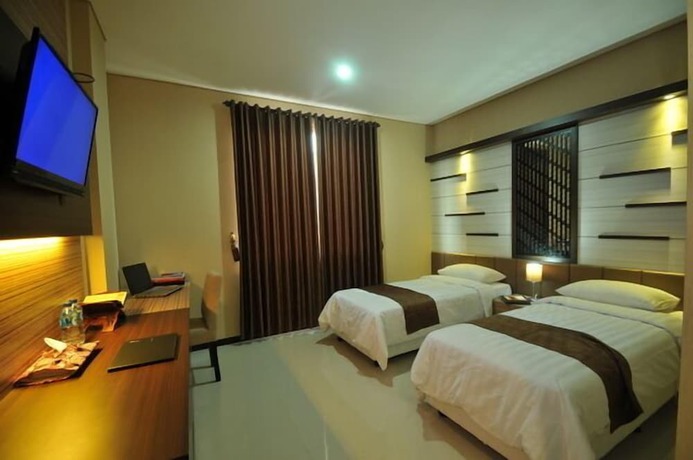 Imagen de la habitación del Hotel D'madinah Residence Syariah Solo. Foto 8