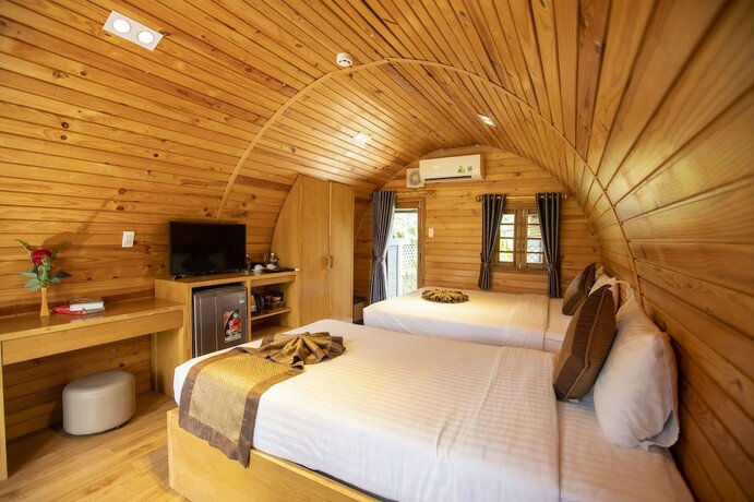 Imagen de la habitación del Hotel Doan Gia Resort Phong Nha. Foto 11