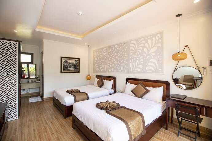 Imagen de la habitación del Hotel Doan Gia Resort Phong Nha. Foto 21