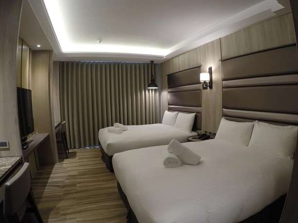 Imagen de la habitación del Hotel Doho confucius hotel. Foto 8
