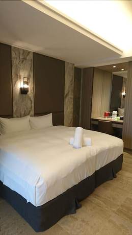 Imagen de la habitación del Hotel Doho confucius hotel. Foto 18
