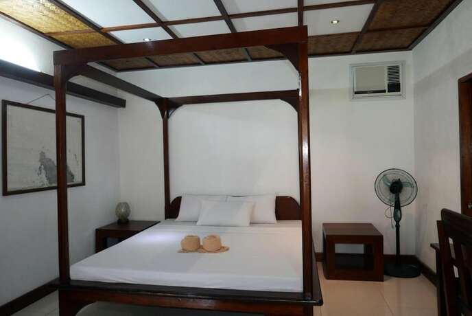 Imagen de la habitación del Hotel Dolarog Beach Resort. Foto 11