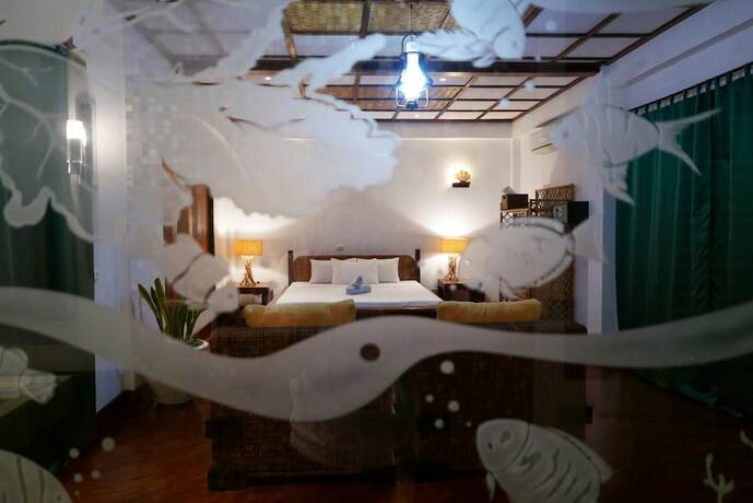 Imagen de la habitación del Hotel Dolarog Beach Resort. Foto 23