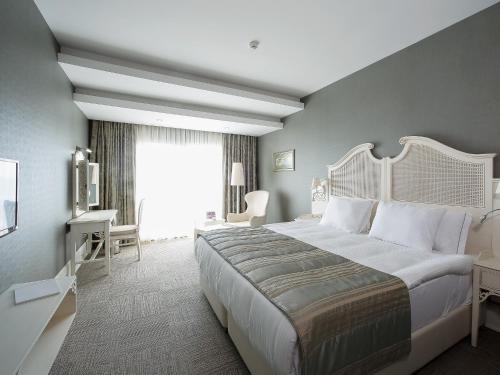 Imagen de la habitación del Hotel Dolce by Wyndham Cesme Alacati. Foto 19
