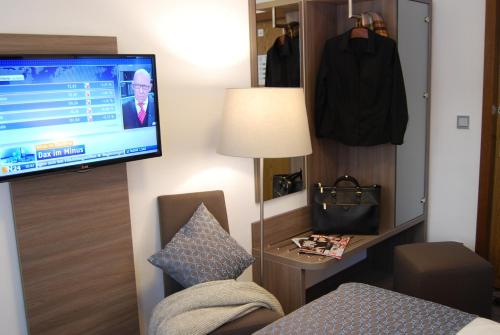 Imagen de la habitación del Hotel Dom Am Römerbrunnen. Foto 8