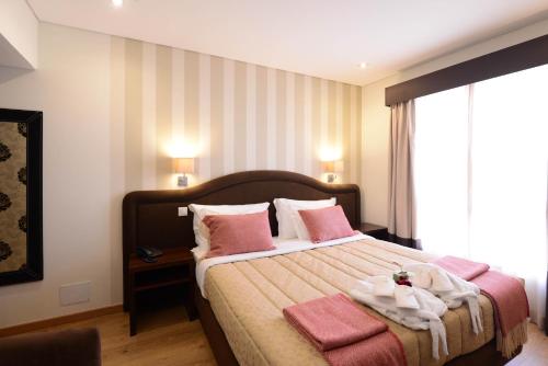 Imagen de la habitación del Hotel Dom Nuno. Foto 19