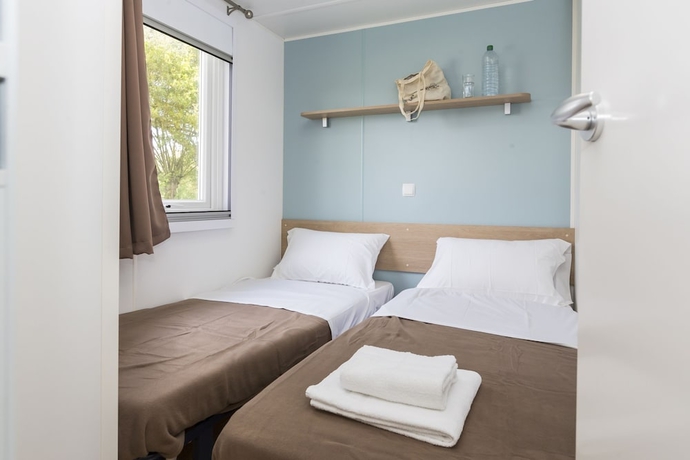 Imagen de la habitación del Hotel Domaine R&eacute;sidentiel de Plein Air Odalys Le Port de la Chaine. Foto 3