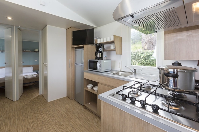 Imagen de la habitación del Hotel Domaine R&eacute;sidentiel de Plein Air Odalys Le Port de la Chaine. Foto 7