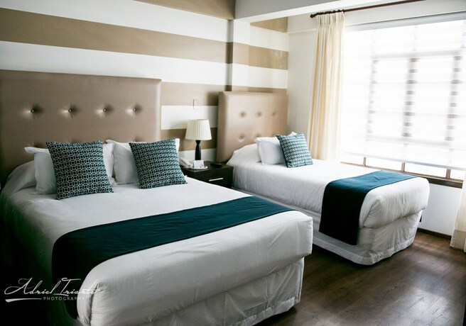 Imagen de la habitación del Hotel Domani Boutique. Foto 17