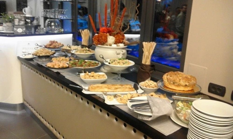 Imagen del bar/restaurante del Hotel Domidea Hotel. Foto 10