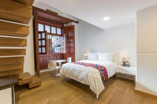 Imagen de la habitación del Hotel Domingo Santo Boutique. Foto 4