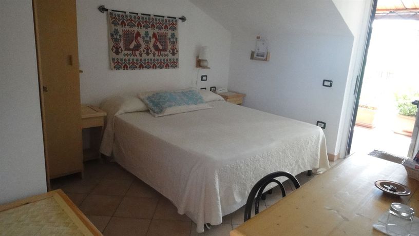 Imagen de la habitación del Hotel Domus De Janas Sul Mare. Foto 8