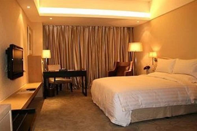 Imagen de la habitación del Hotel Dong Huang. Foto 7