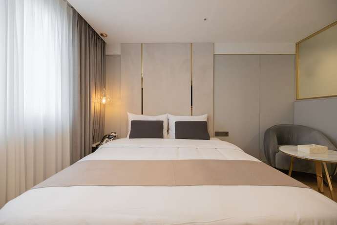 Imagen de la habitación del Hotel DongRae Denbasta. Foto 7