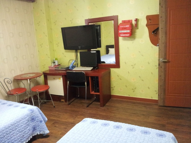Imagen de la habitación del Hotel Dongdo. Foto 6
