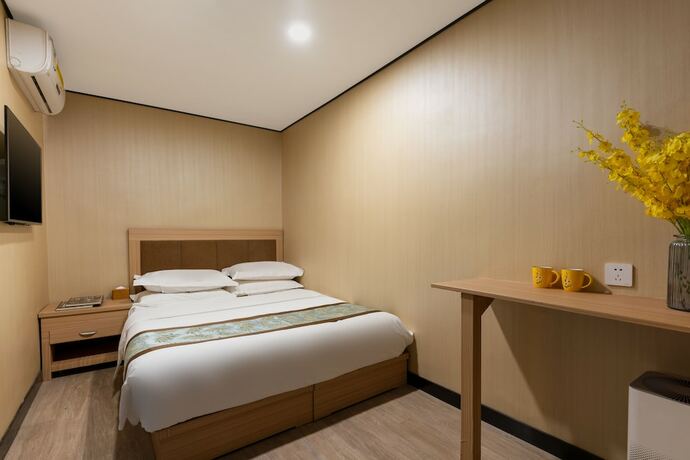 Imagen de la habitación del Hotel Dongfang Shengda Cultural. Foto 13
